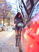 Jeny poses on a city street wearing just a stylish jacket, black seamless pantyhose and tall boots, her feminine curves and private areas fully on display